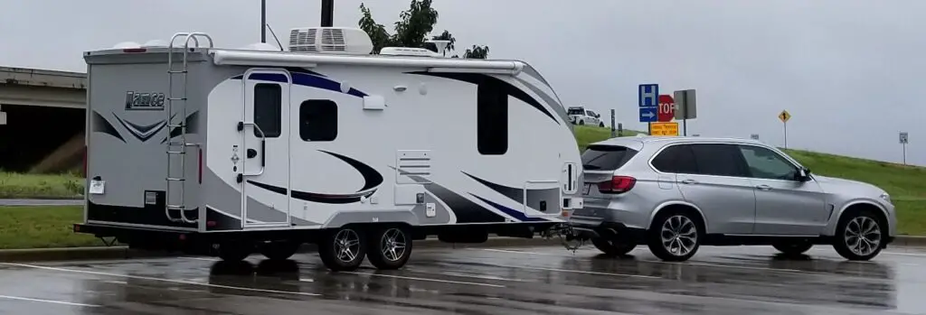 BMW X7 towing a travel trailer