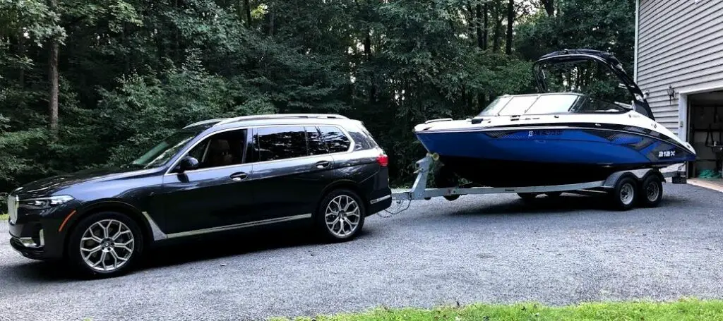 BMW X7 Towing a Boat On A Trailer