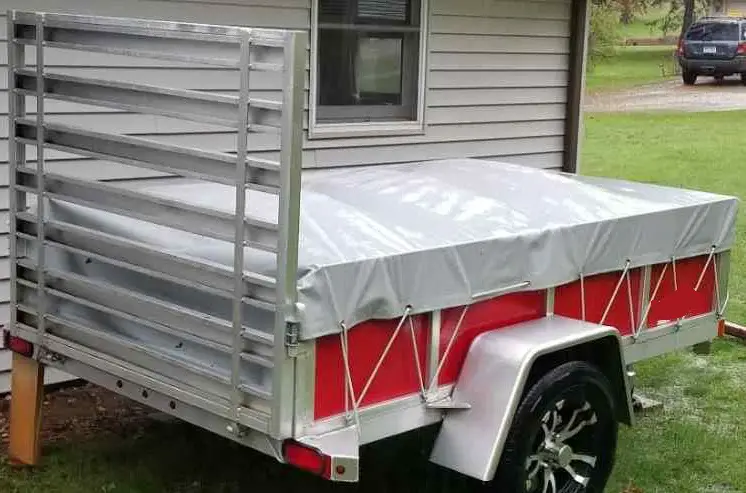 trailer with tarp over it