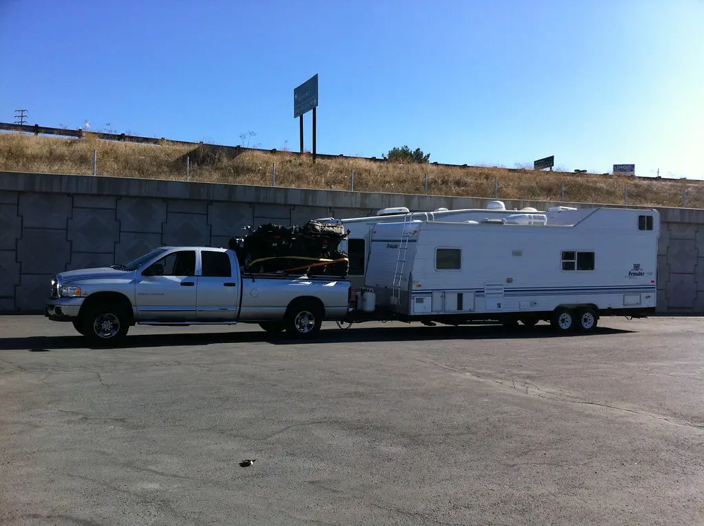 truck with full payload towing heavy travel trailer
