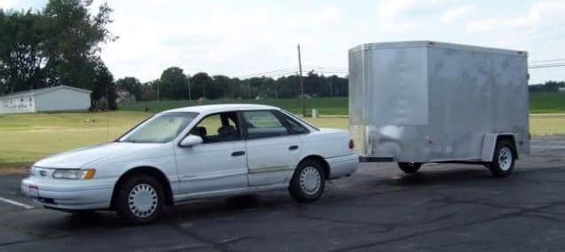 Ford Taurus towing a trailer