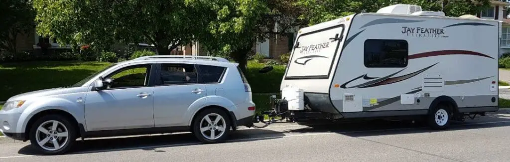 Mitsubishi Outlander towing a travel trailer