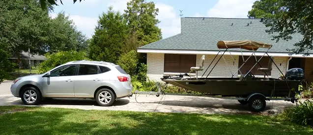 Nissan Rogue towing a boat trailer