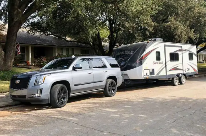cadillac escalade towing a travel trailer