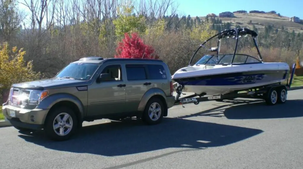 dodge nitro towing a boat trailer