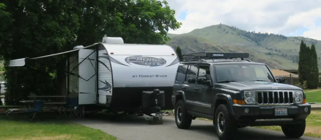 jeep commander towing a travel trailer