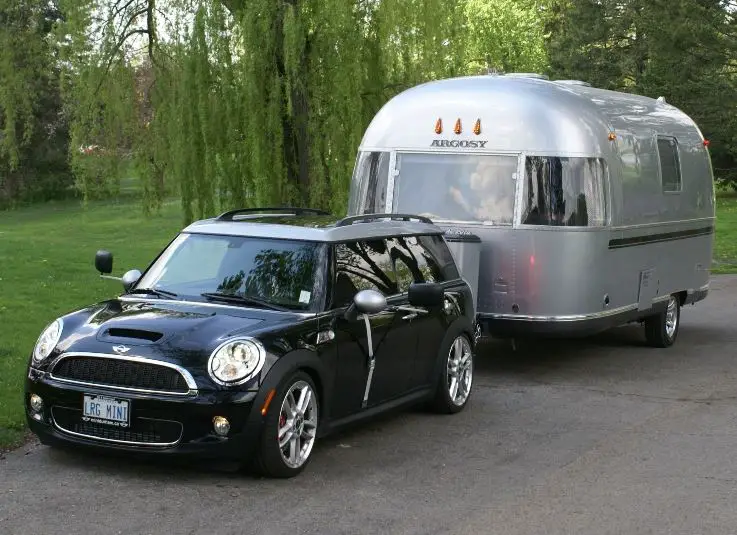 mini country towing an airstream trailer