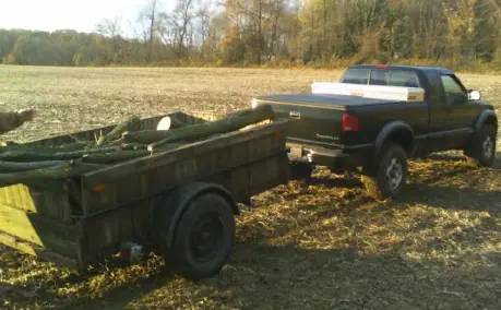 Chevy S10 towing a landscaping trailer